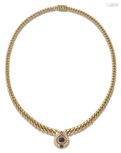 A gold necklace, of curb link design supporting a cabochon s...