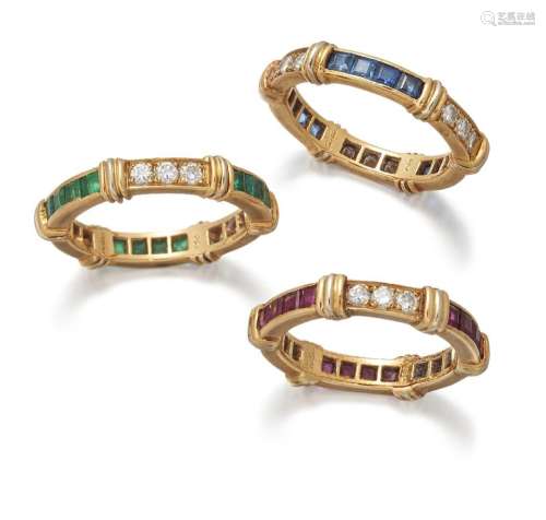 Cartier, a set of three gem-set and diamond eternity rings, ...