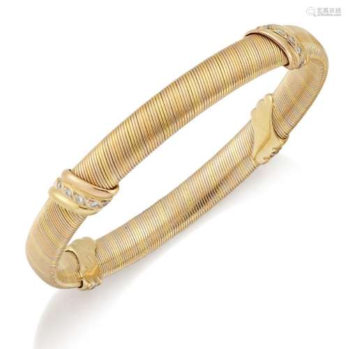 Cartier, diamond bangle, by Cartier, of twisted three tone d...