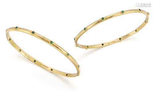 Theo Fennell, a pair of gold and emerald bangles, each accen...