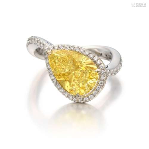 Fancy Vivid Yellow Diamond and Diamond Ring . Fancy Vivid Ye...