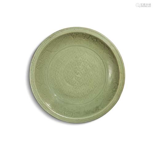 A large carved ‘Longquan’ celadon-glazed charger, Ming dynas...