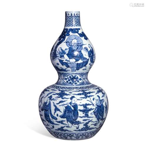 A blue and white double-gourd 'Eight Daoist Immortals' vase,...