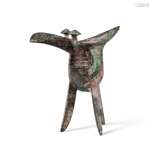 An inscribed archaic bronze ritual wine vessel (Jue), Late S...