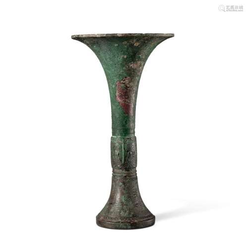 An inscribed archaic bronze ritual wine vessel (Gu), Late Sh...