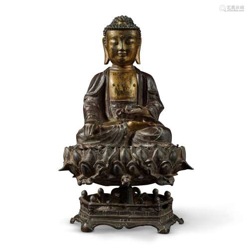 A parcel-gilt bronze seated figure of Buddha, Late Ming dyna...