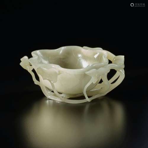 A celadon jade 'lotus' brush washer, Qing dynasty, 18th cent...