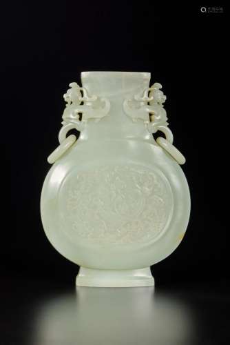 A pale celadon jade 'chilong' vase, Qing dynasty, Qianlong p...