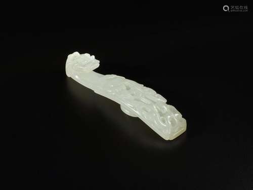 A celadon jade 'chilong and phoenix' belt hook, Qing dynasty...