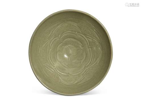 A large carved 'Yaozhou' celadon-glazed 'floral' bowl, North...