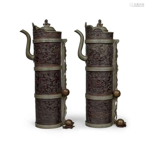 A rare pair of coconut shell pewter-mounted Tibetan-style ew...