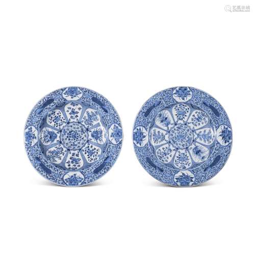 A pair of large blue and white 'floral peacock' dishes, Qing...