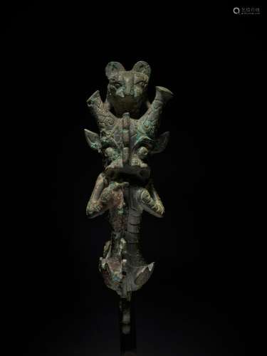 An exceptional and rare archaic bronze 'mythical beast' hand...