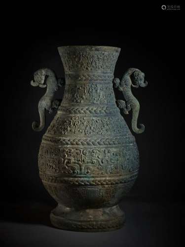 An exceptional and rare archaic bronze wine vessel (Hu), Eas...