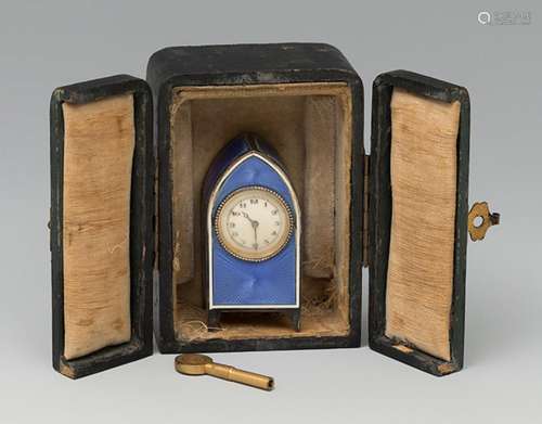 Table clock. Late 19th century. Silver and blue guilloché en...