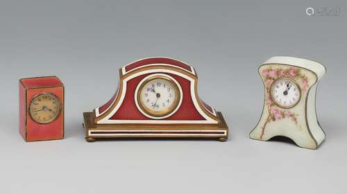 Set of three travel clocks, bronze, silver and enamel. Ca. 1...