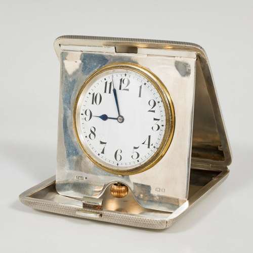 Travel alarm clock; early 20th century.Silver.Silver frame a...