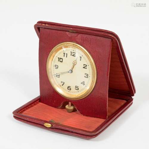 Travel alarm clock; 20th century.Red leather case.Measuremen...