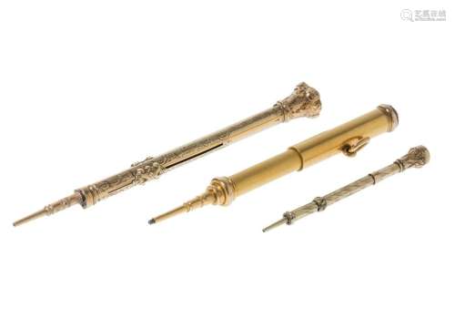 Set of three pencils in yellow gold, two of 9 kts. and one o...