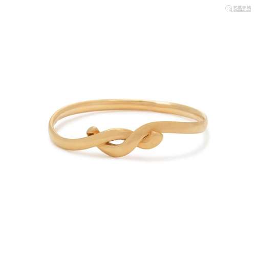 TIFFANY & CO., ANGELA CUMMINGS, YELLOW GOLD BANGLE BRACE...