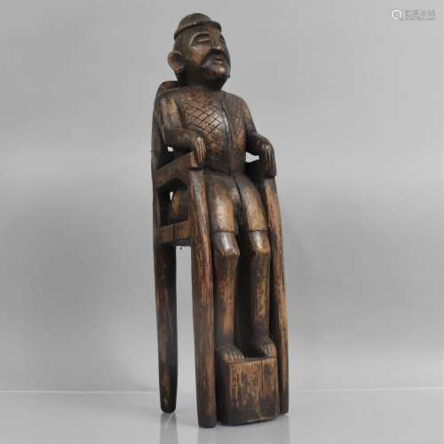 A 19th Century Indonesian Carved Hardwood Figure of a Tribal...