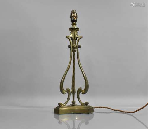 An Edwardian Brass Table Lamp of Triform Shape with Scrolled...