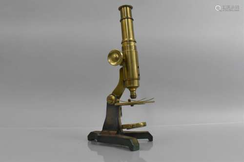 A Late 19th Century Brass Microscope Mounted on an Iron Stan...