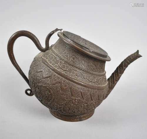 An Indian Kashmir Metal Tilting Teapot with Intricate Foliat...