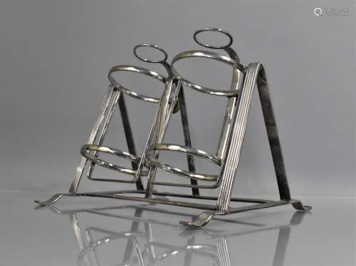 An Early 20th Century Silver Plated Gimballed Bottle Stand h...