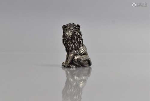 A Magrino Filled Silver Study of a Seated Lion, 5cms High