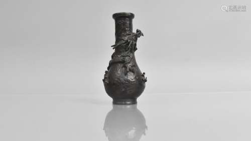 A Small Japanese Bronze Bottle Vase, Decorated in Relief wit...
