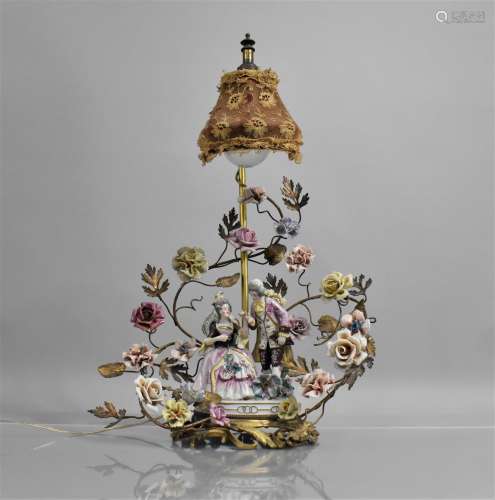 A Continental Porcelain and Gilt Metal Table Lamp, Seated La...