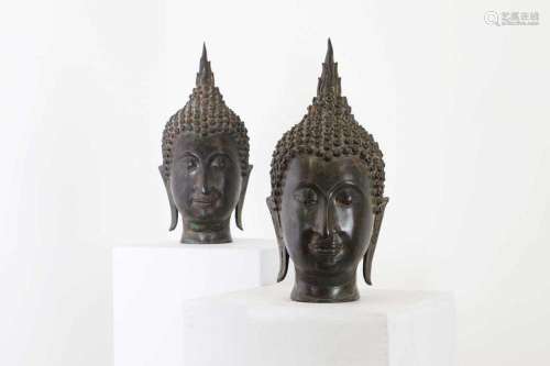 A pair of bronze U-Thong-style Buddha heads