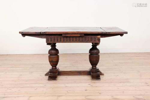 An oak and walnut draw-leaf table,