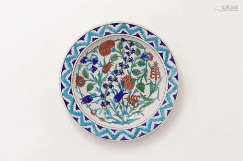 An Iznik-style pottery charger by Thodore Deck,