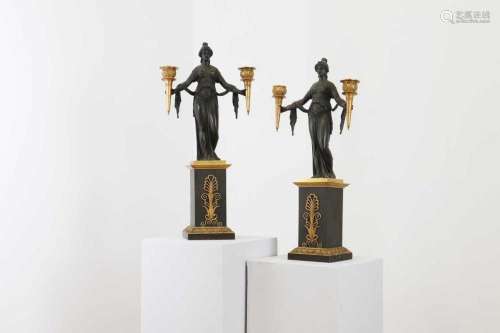 A pair of Empire gilt and patinated bronze candelabra,