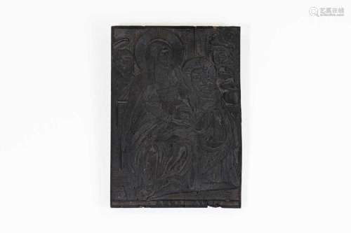 A carved wood printing block,