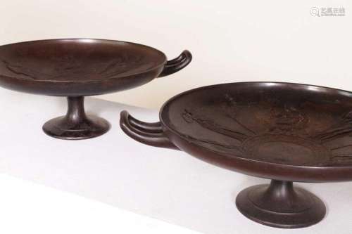 A pair of neoclassical patinated cast iron kylix by E W Wyon...
