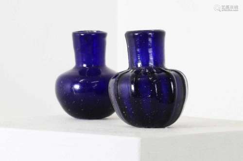 Two blue glass miniature bottles,