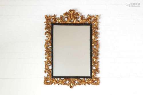 A carved giltwood mirror in the Florentine style,