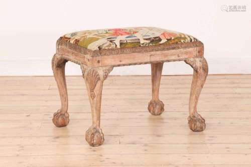 A George II-style carved walnut stool,