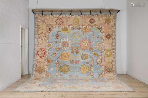 A large Oushak wool carpet,