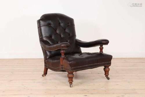 A late Victorian buttoned-leather armchair,