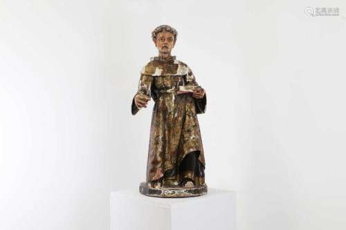 A carved, painted and gilt, pine figure of St. Anthony of Pa...