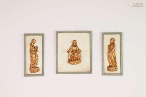 A carved giltwood relief triptych,