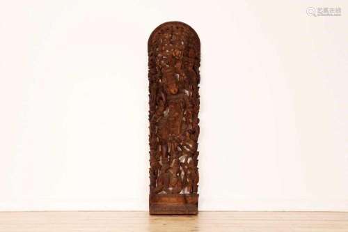 A carved hardwood panel depicting a bodhisattva,