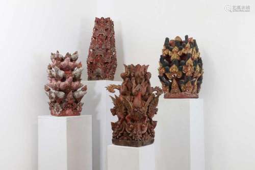 A group of four carved and polychrome columns,