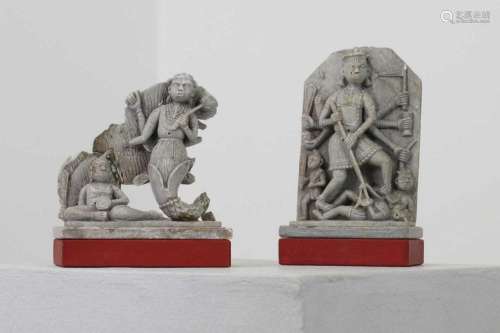 Two soapstone carvings depicting Hindu deities,