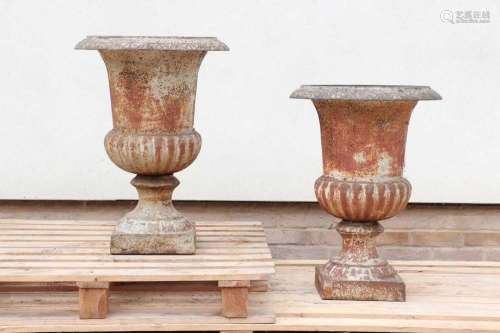 A pair of cast iron campana urns,