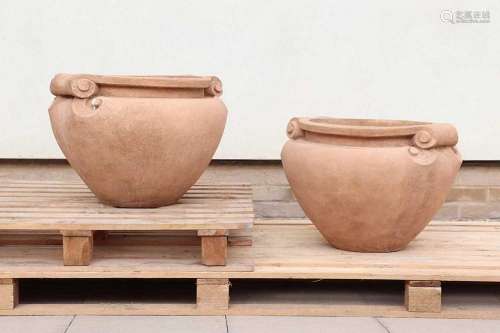 A pair of composition stone scroll pots,